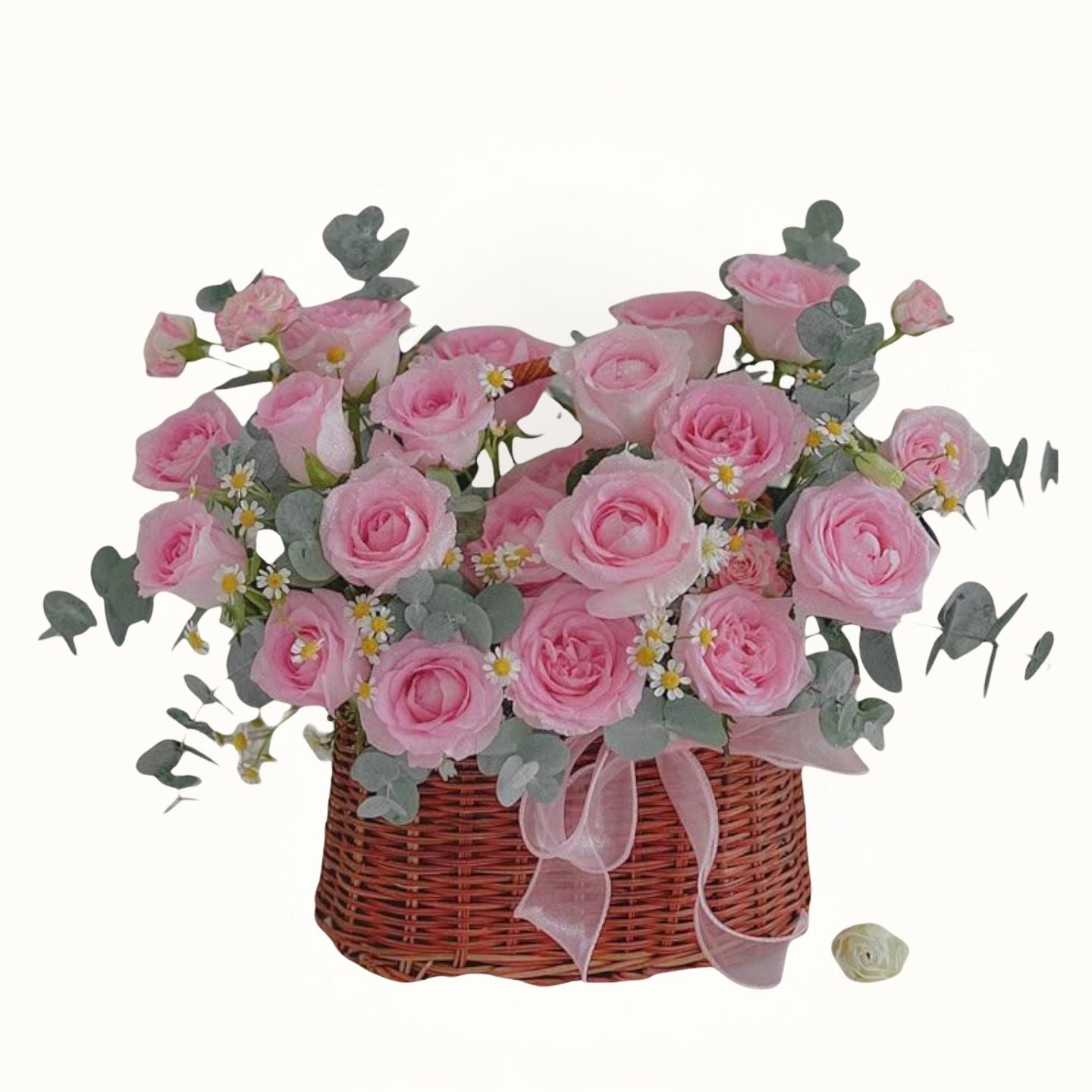 Bouquet of pink roses in a wicker basket with a white background