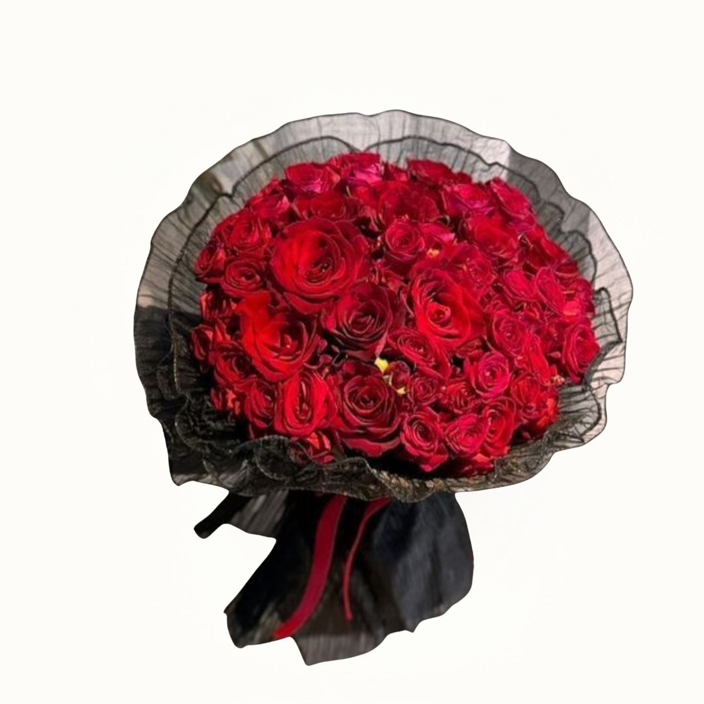 Bouquet of red roses wrapped in black paper with a red ribbon on a white background