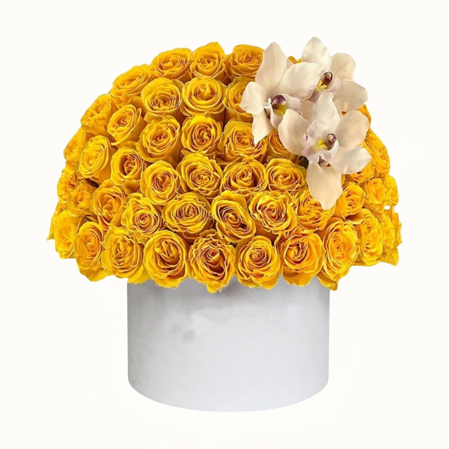 White box filled with yellow roses and white orchids on a white background