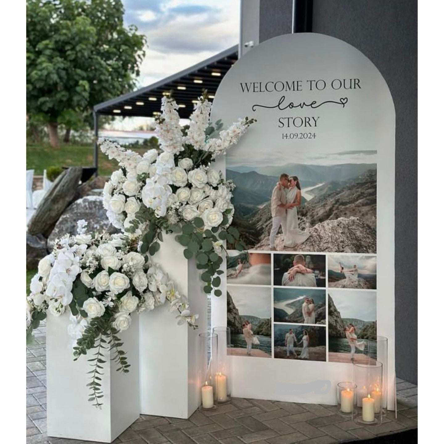 Proposal Decoration with white flowers and couple picture