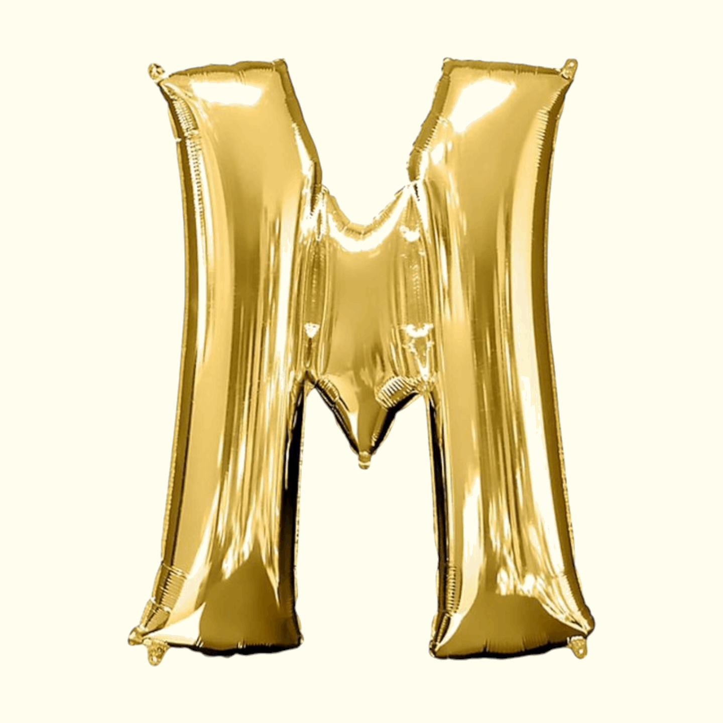 Gold letter 'M' balloon on a white background
