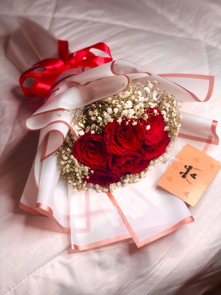 Red Roses and White gypsophila with pink wrapping