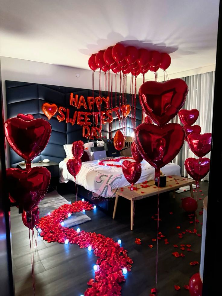 Red hearts balloons and red roses bedroom decoration
