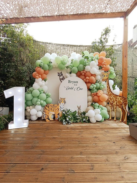 1 birthday decoration with purple, green, white balloons 