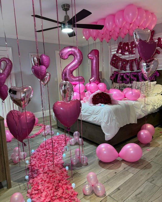 Purple birthday decoration with pink roses 