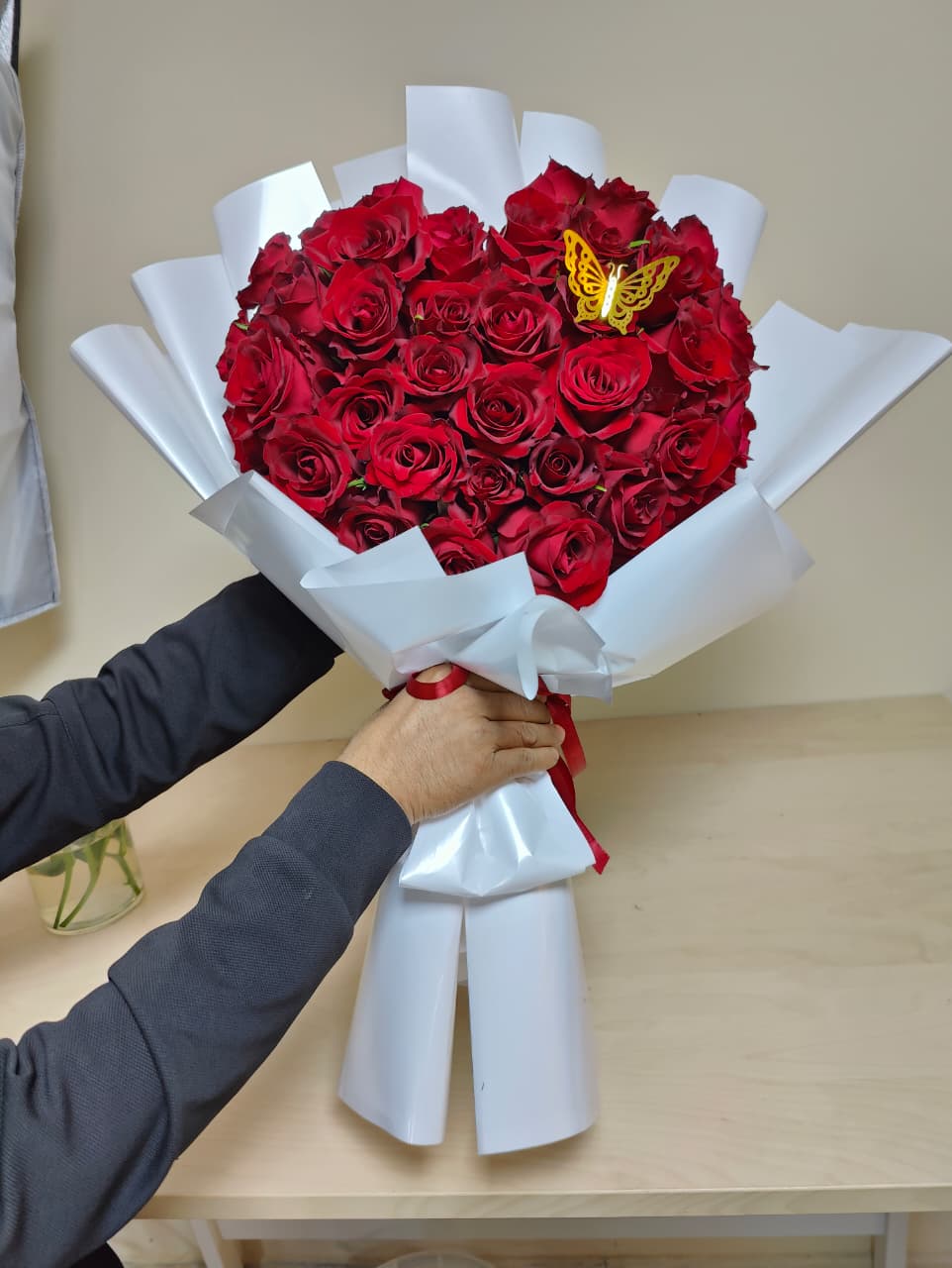 Butterfly red roses bouquet with white wrapping 
