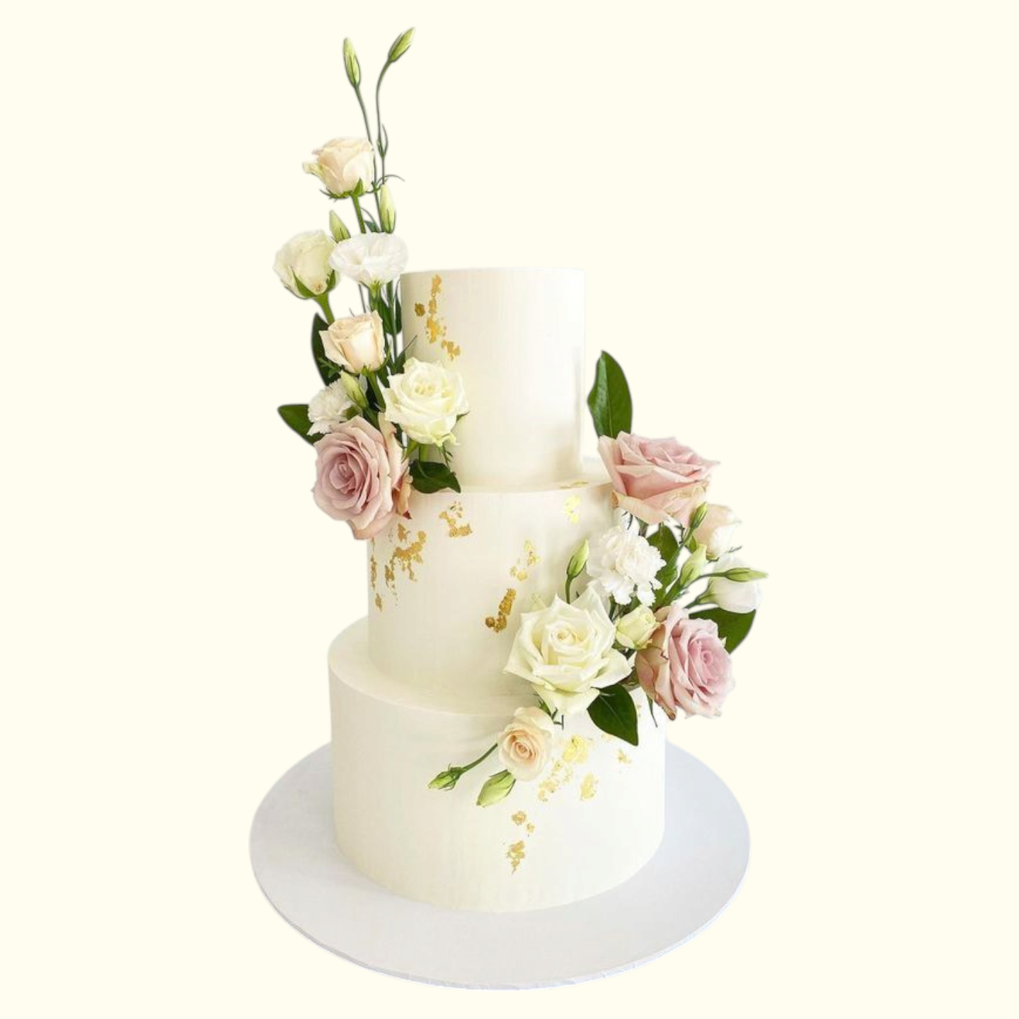 Two-tiered white cake decorated with pink and white flowers on a white background