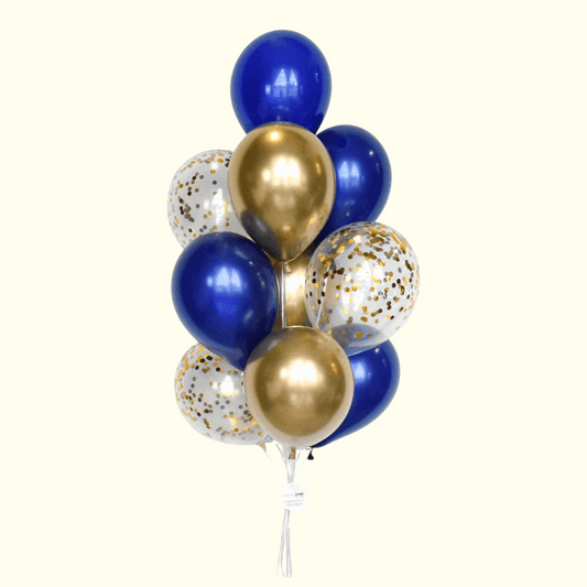 Bouquet of blue, gold, and clear balloons with confetti on a white background