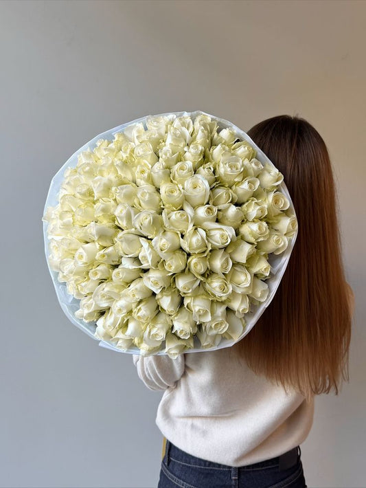 White roses bouquet with white wrapping 