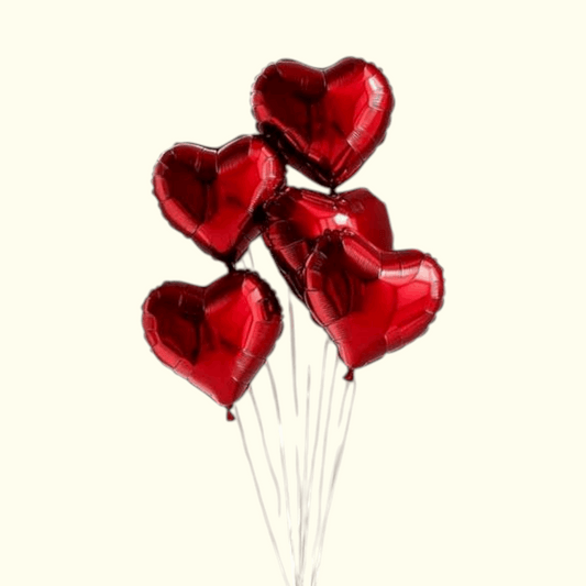 Bunch of red heart-shaped balloons on a white background
