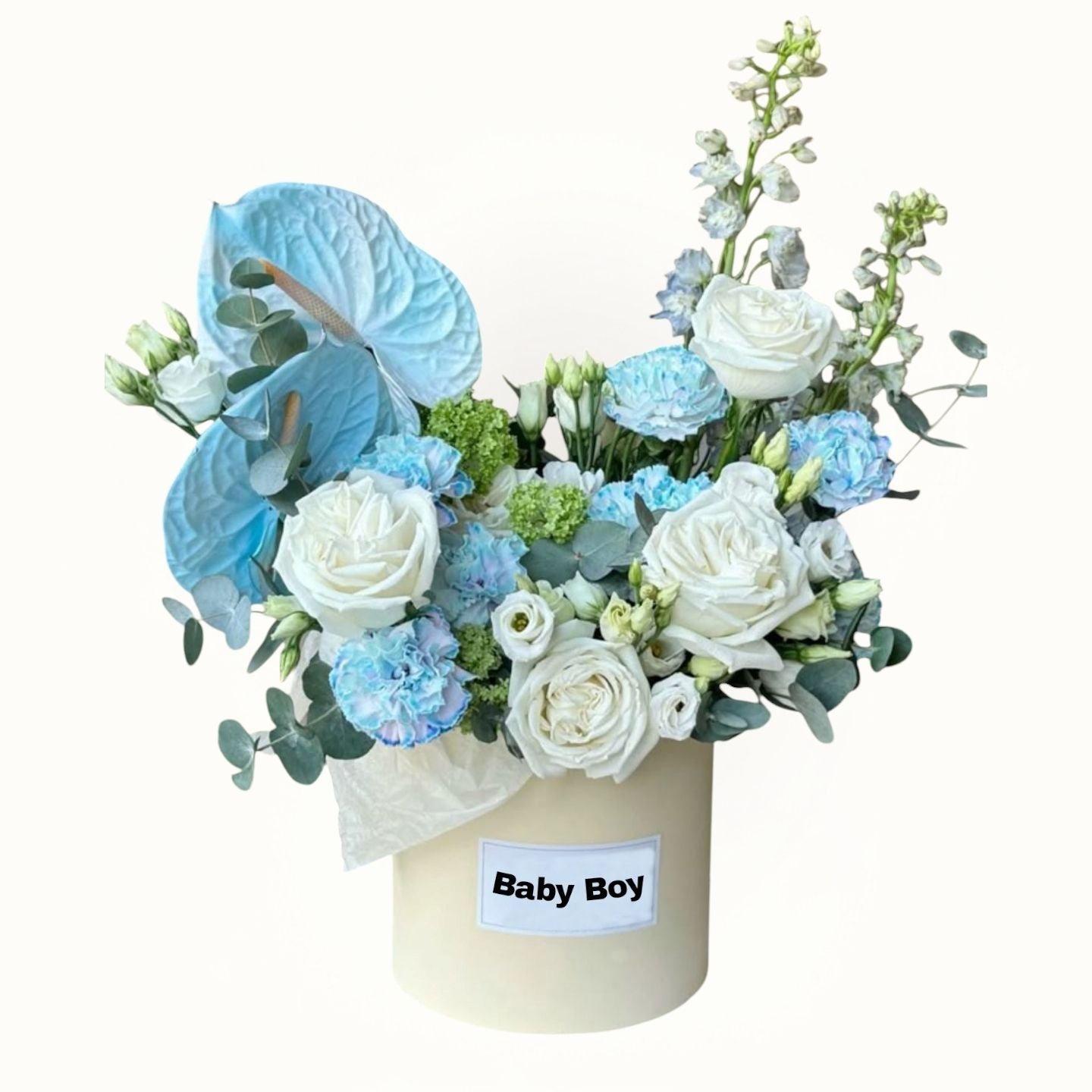 Floral arrangement in a box labeled 'Baby Boy' on a white background