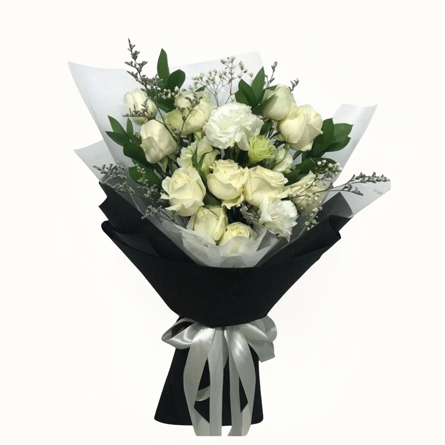 Bouquet of white and green roses wrapped in black paper with a white ribbon on a white background