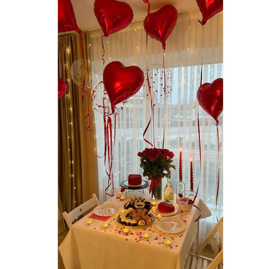Birthday table decoration, with red heart balloons in dubai