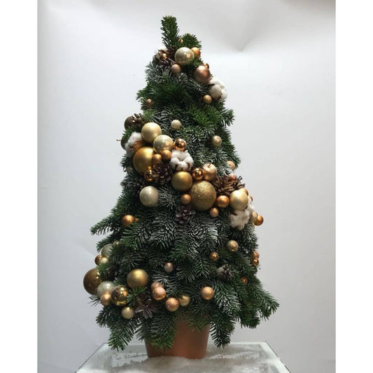 Decorative Christmas tree with gold and silver ornaments on a white background