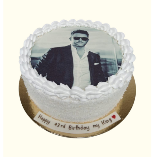 Cake with a photo of a man on top, with text 'Happy 43rd Birthday my King' 
