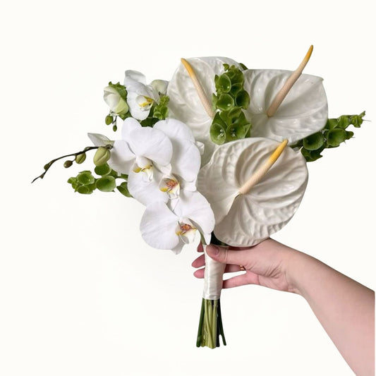Hand holding bridal flower bouquet in Dubai, UAE