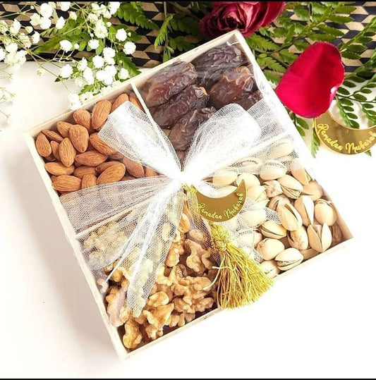 Dry fruit gift hamper with nuts and dates and other 