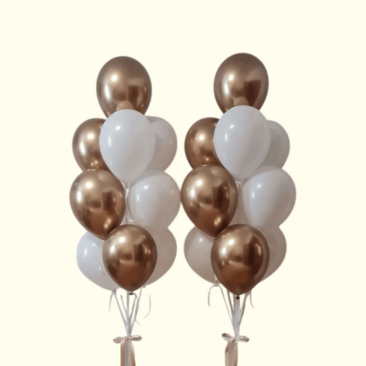 Two bunches of balloons with gold, white, and bronze colors on a white background