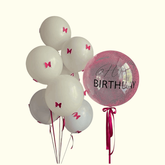 White balloons with pink butterfly decorations and a 'Happy Birthday' balloon on a white background