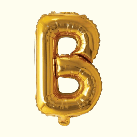 Gold letter 'B' balloon on a white background