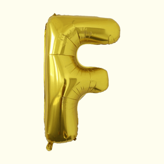 Gold letter 'F' balloon on a white background