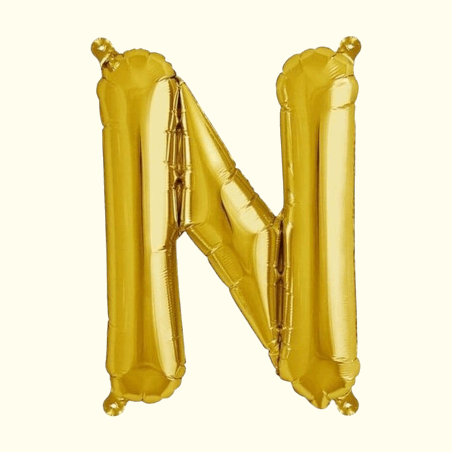 Gold letter 'N' balloon on a white background