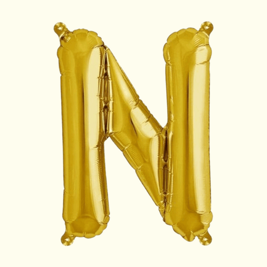Gold letter 'N' balloon on a white background