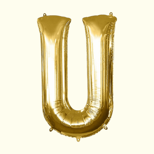 Gold letter 'U' balloon on a white background
