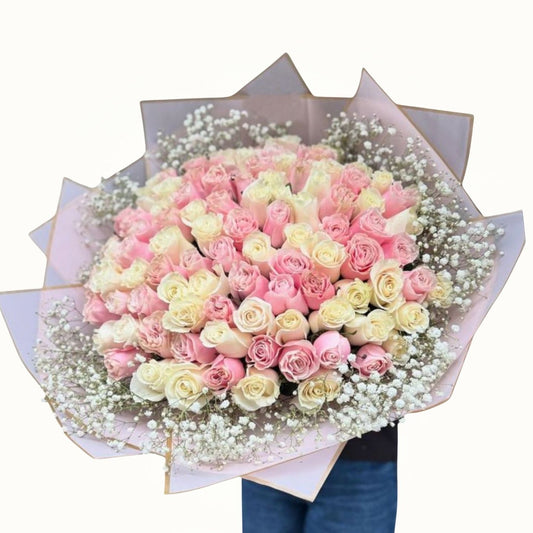 Bouquet of pink and white roses with a light background
