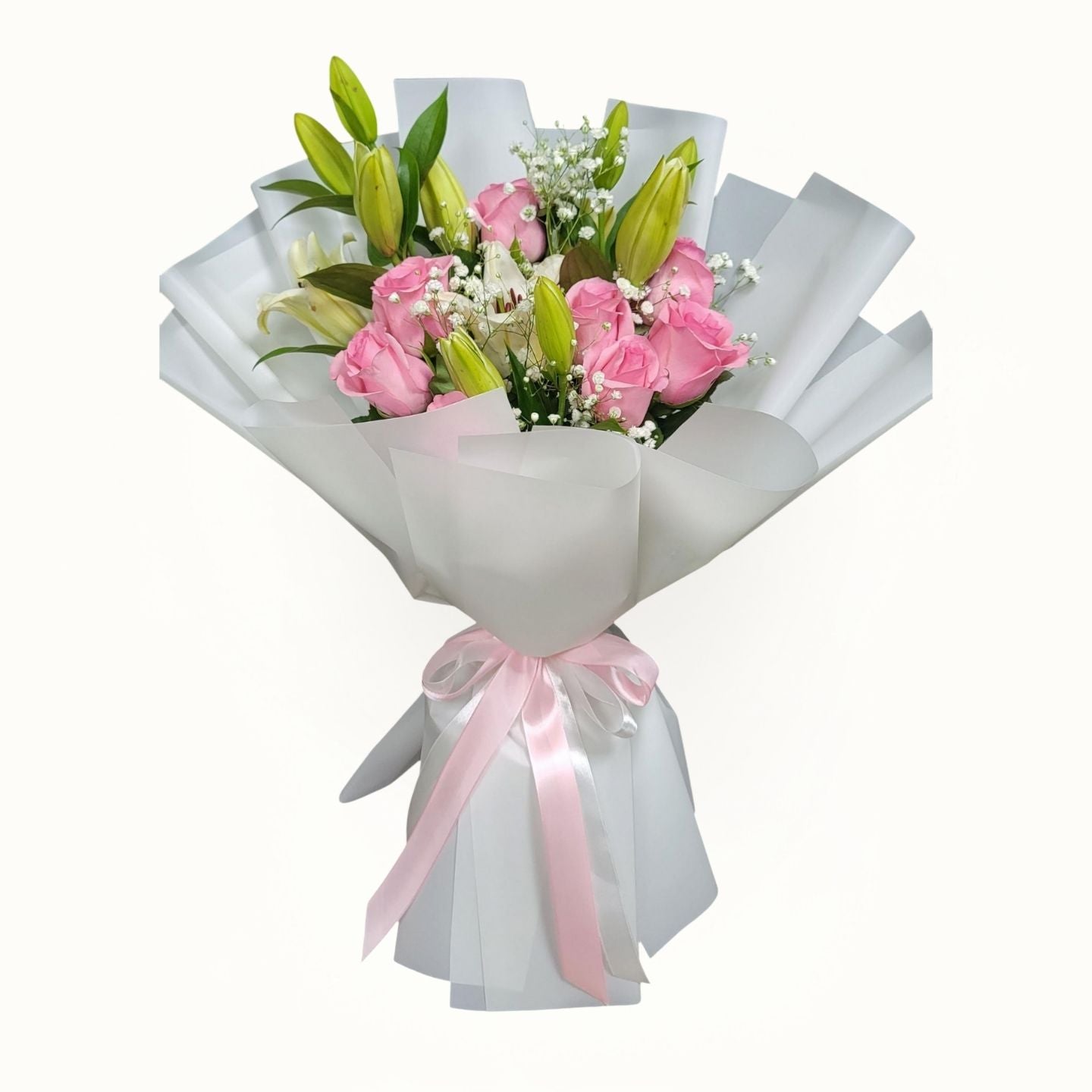 Bouquet of flowers wrapped in white paper with a pink ribbon on a white background