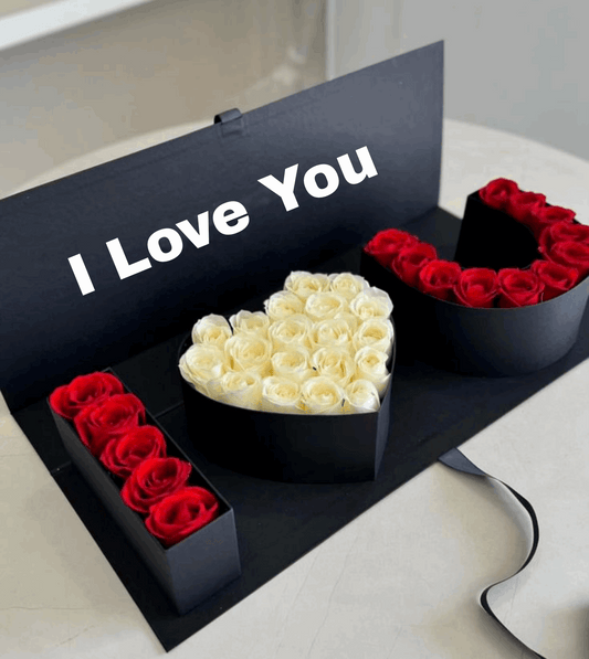 Heart-shaped boxes with white and red roses and 'I Love You' message