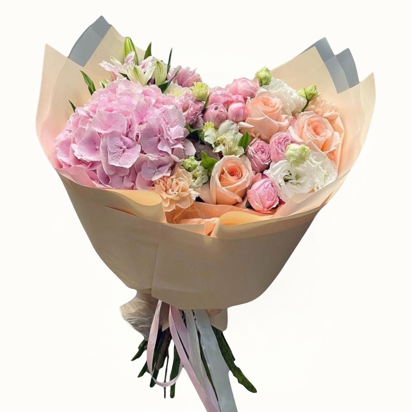 Bouquet of pink and white flowers wrapped in brown paper on a white background