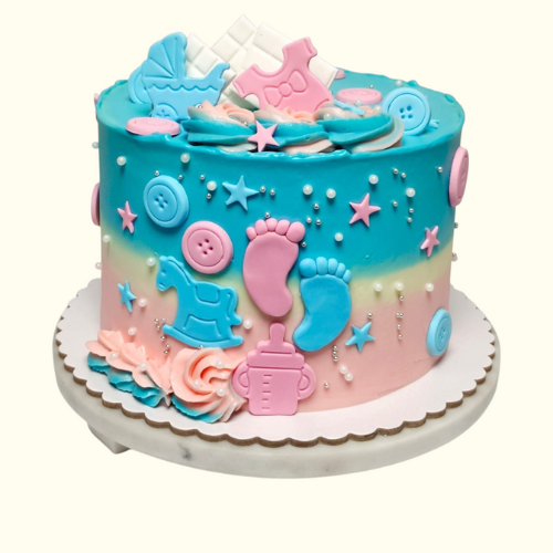 Colorful baby-themed cake with blue and pink decorations 