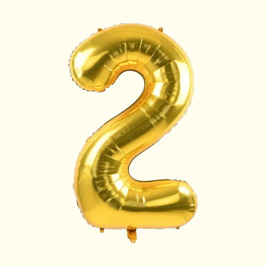 Gold number 2 balloon on a white background