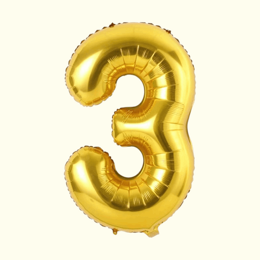Gold number 3 balloon on a white background