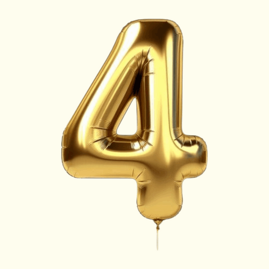 Gold number 4 balloon on a white background
