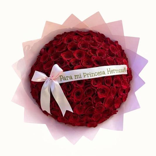 Bouquet of red roses with a white ribbon and message on a white background