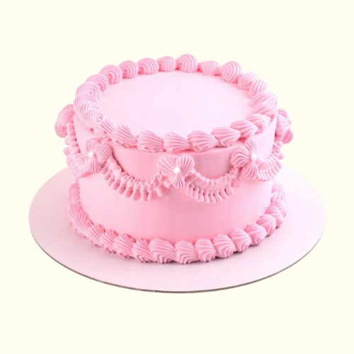 Pink cake with decorative frosting
