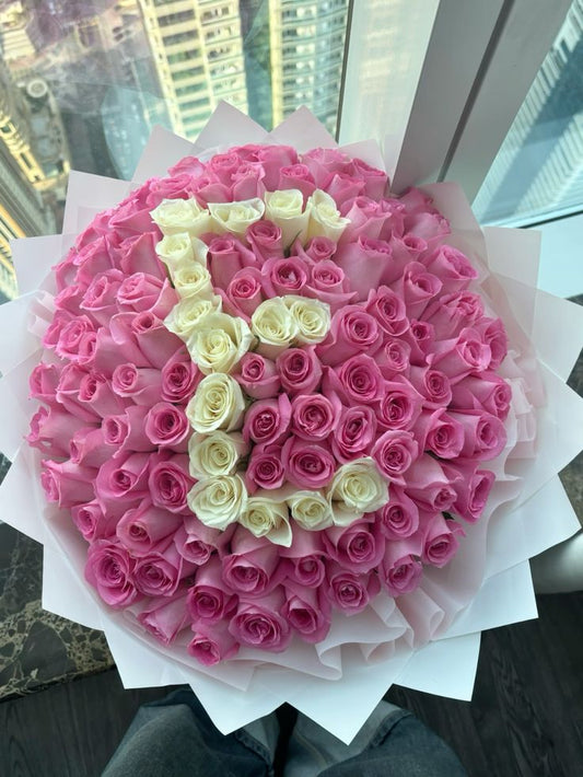 100 Pink and white roses bouquet with white wrapping 