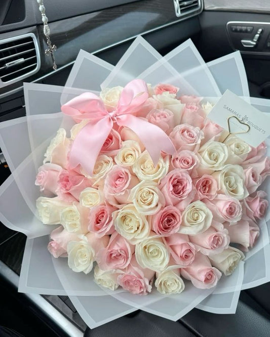 Pink and White flower bouquet with white wrapping 
