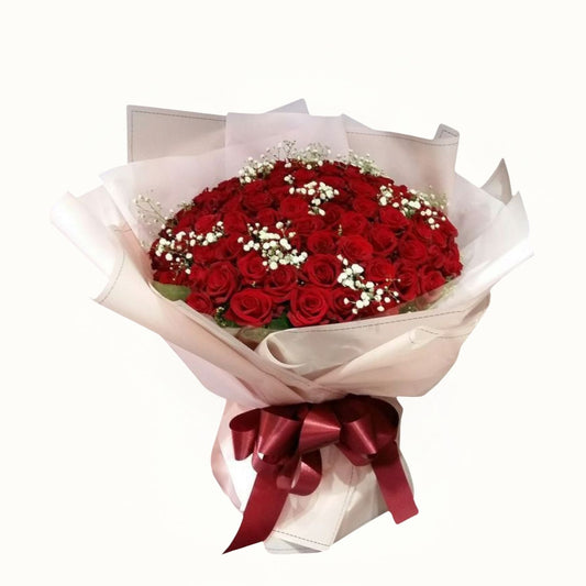 Red Roses Flower bouquet with pink wrapping 