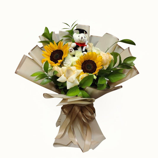 Bouquet of flowers with sunflowers and a small teddy bear on a white background