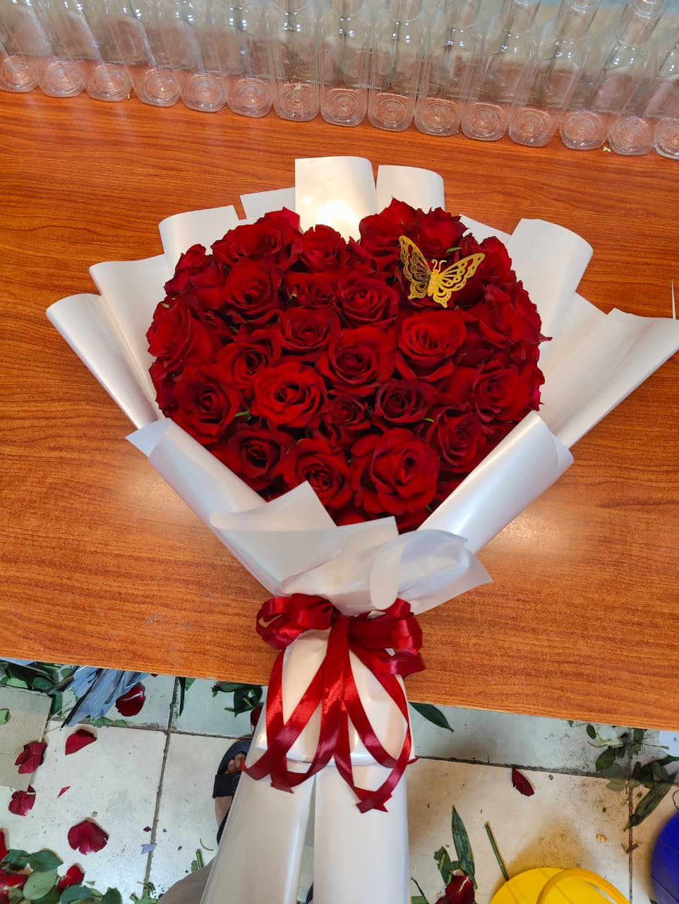 Butterfly red roses bouquet with white wrapping 