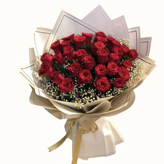 Bouquet of red roses wrapped in paper with a white envelope on a white background