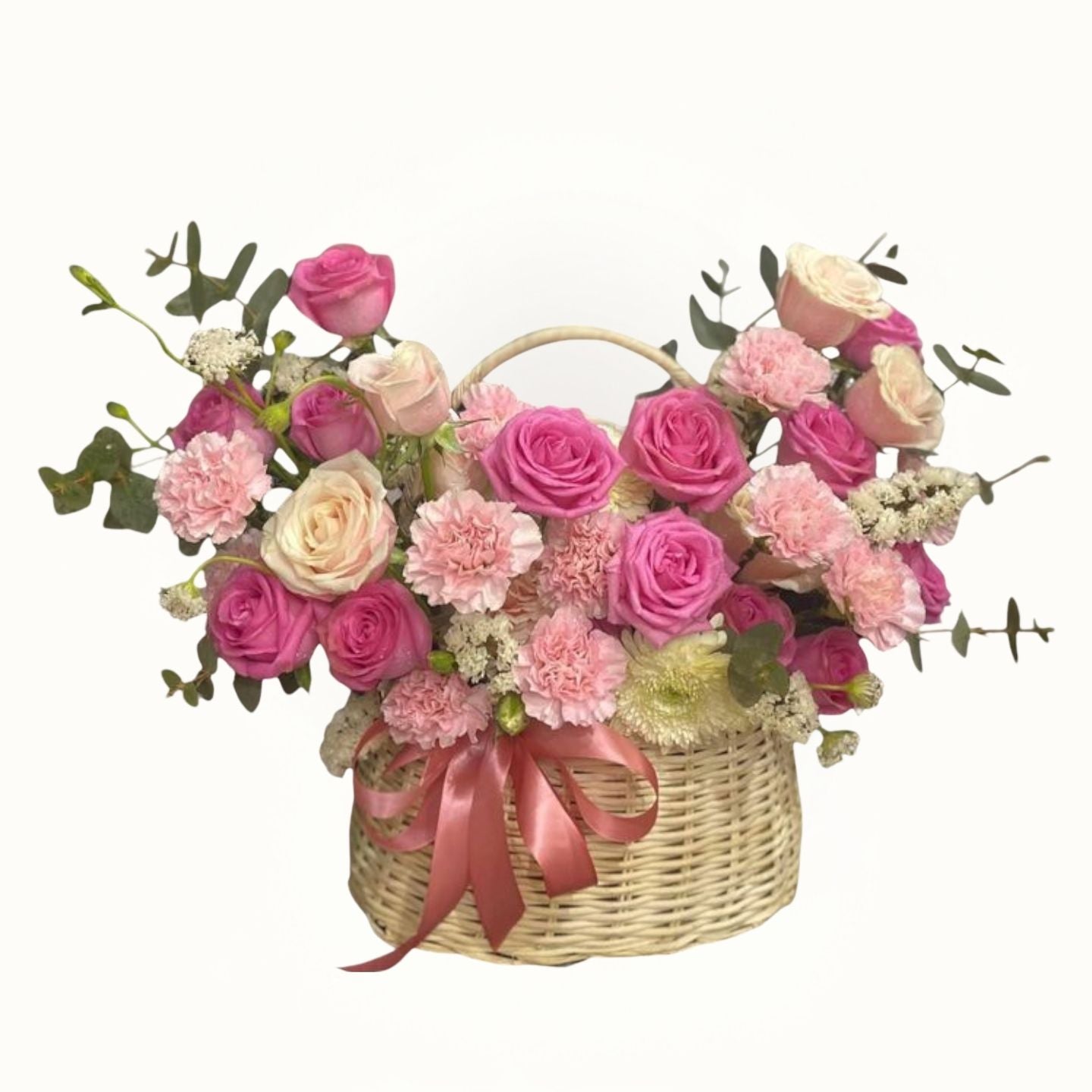 Basket of pink and white flowers with a pink ribbon on a white background