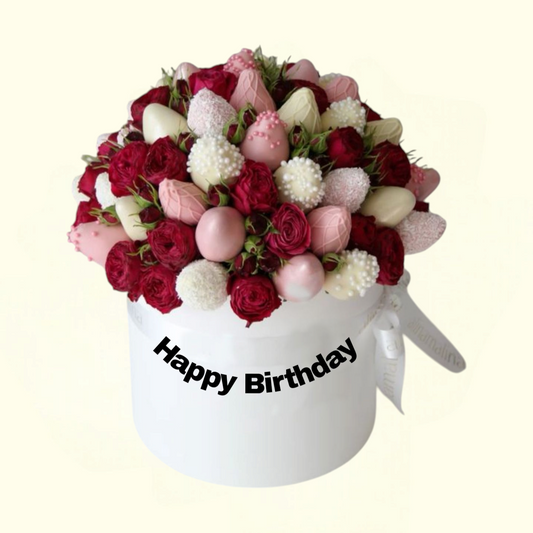 Floral arrangement in a box with 'Happy Birthday' text on a white background