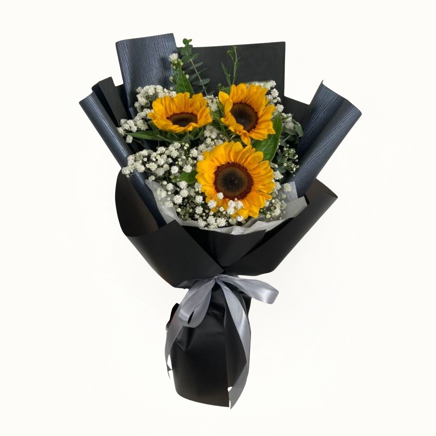 Bouquet of sunflowers wrapped in black paper with a gray ribbon 