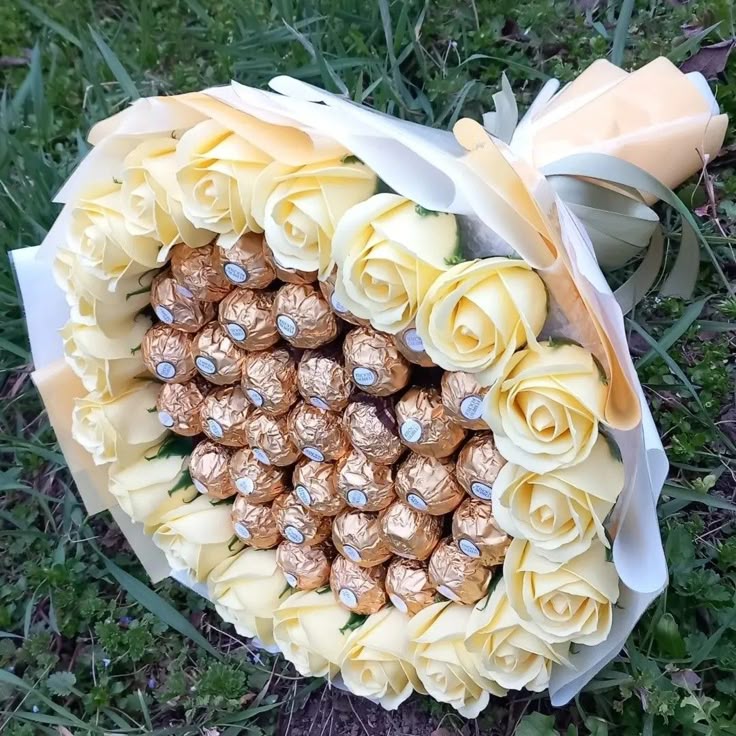Ferror rocher and white roses flower bouquet 