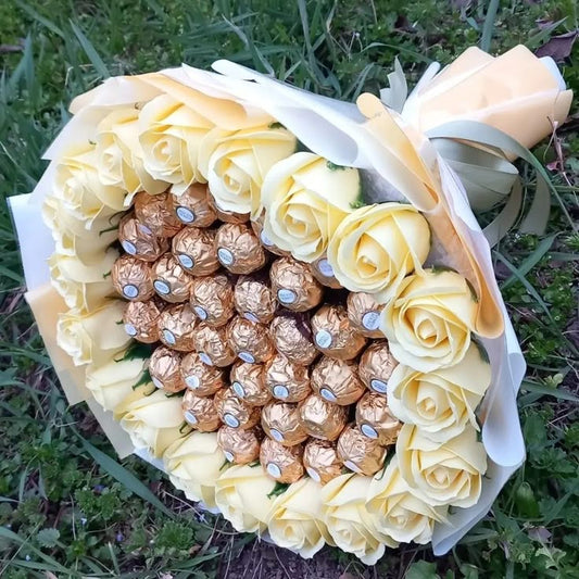 Ferror rocher and white roses flower bouquet 