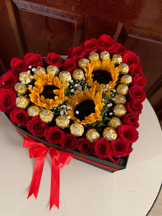 Red roses and sunflowers heart box with chocolates in Dubai, UAE 